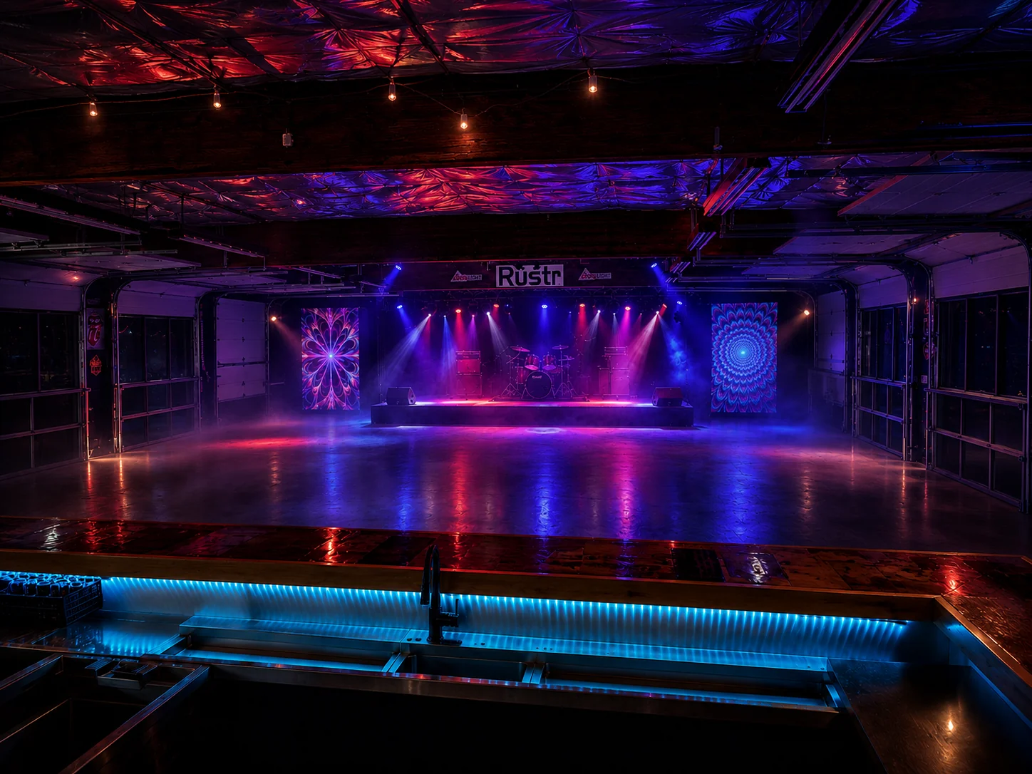 Rüstr Music Hall at night with concert lighting and fog